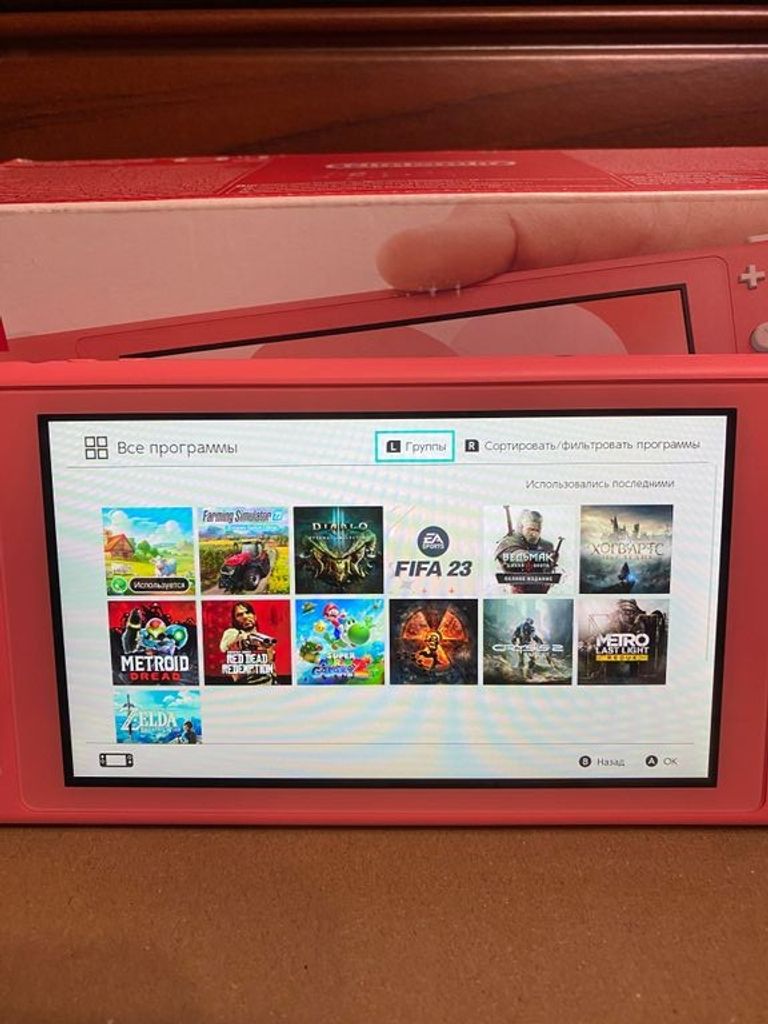 Дешево Nintendo Switch Lite Coral + The Witcher 3: Wild Hunt Complete Edition з ломбарду