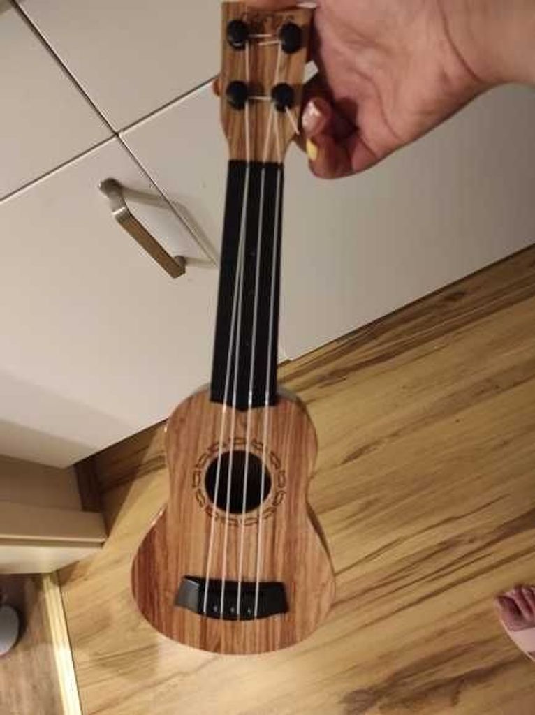 Купити Іграшкова гітара із медіатором Б/У