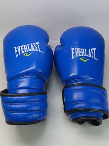 Б/у Боксерские перчатки Everlast 12 oz шкіра синьо-чорні 01-200867957
